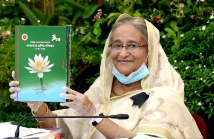 PM unveils cover of two reports