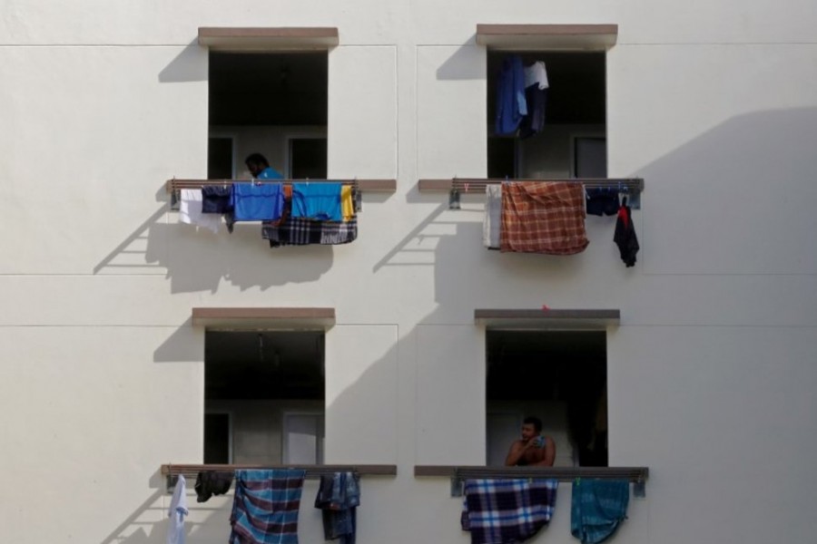 Singapore rushes to build housing for 60,000 migrant workers after virus outbreak