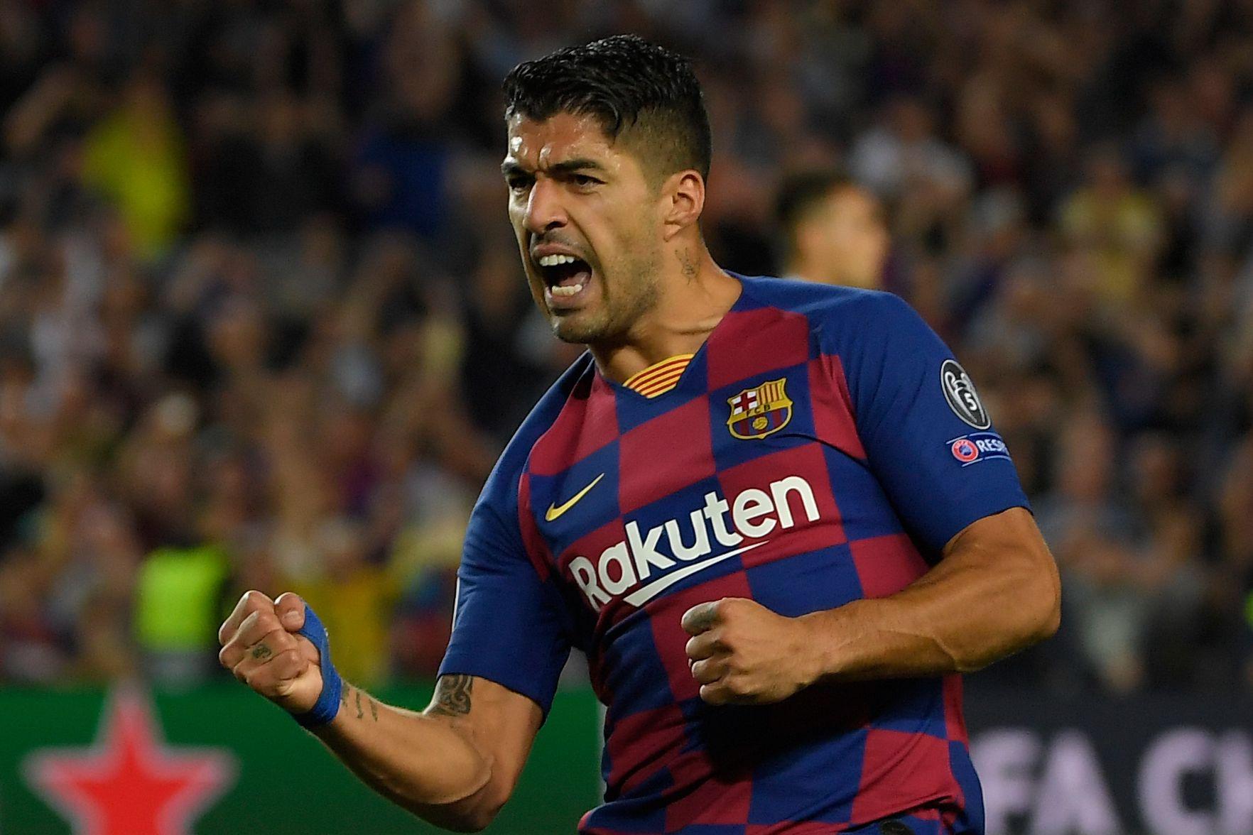 Suarez scores 2 to give Barca 2-1 comeback win over Inter