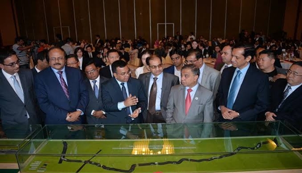Local officials listen to introduction about the Dhaka Bypass Expressway project at the contract signing ceremony in Dhaka