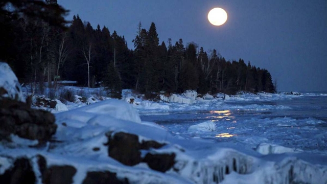 The final supermoon of the year occurs as an asteroid zips close by